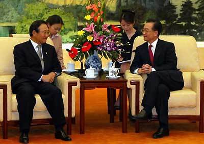 温家宝回见李台燮电影花迹图片