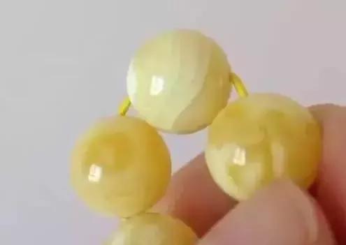 【北方之金】压制蜜蜡怎么辨别?